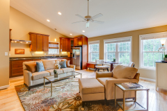Open great room with vaulted ceiling and connected kitchen