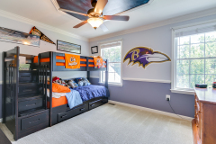 Boys' bedroom with custom bunk beds and accent wall