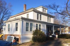 Exterior of home with new addition framed and sided
