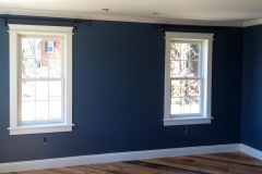 Addition with finished trim, fresh paint, and refinished hardwood floors