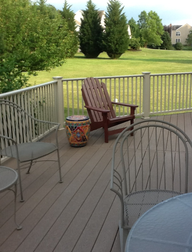 Residential deck with railing and lounge seating