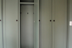 Custom built-in wardrobe with shaker doors and dark hardware