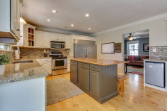 Open-concept kitchen with island and stainless appliances