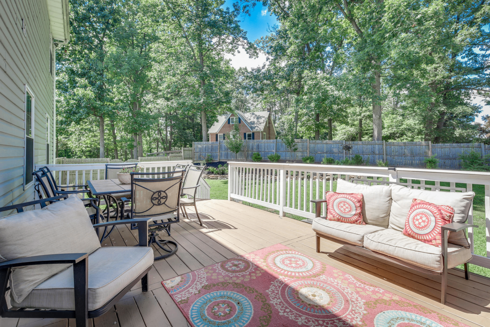 Backyard deck seating area with outdoor furniture