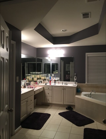 Master bathroom before remodel with dated vanity and tray ceiling