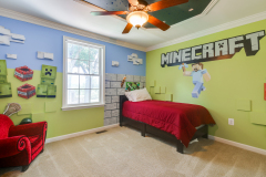 Kid's themed bedroom with custom wall murals and trim