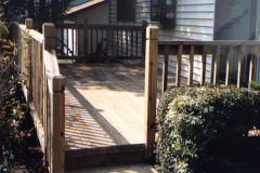Custom cedar deck landing with steps and railing