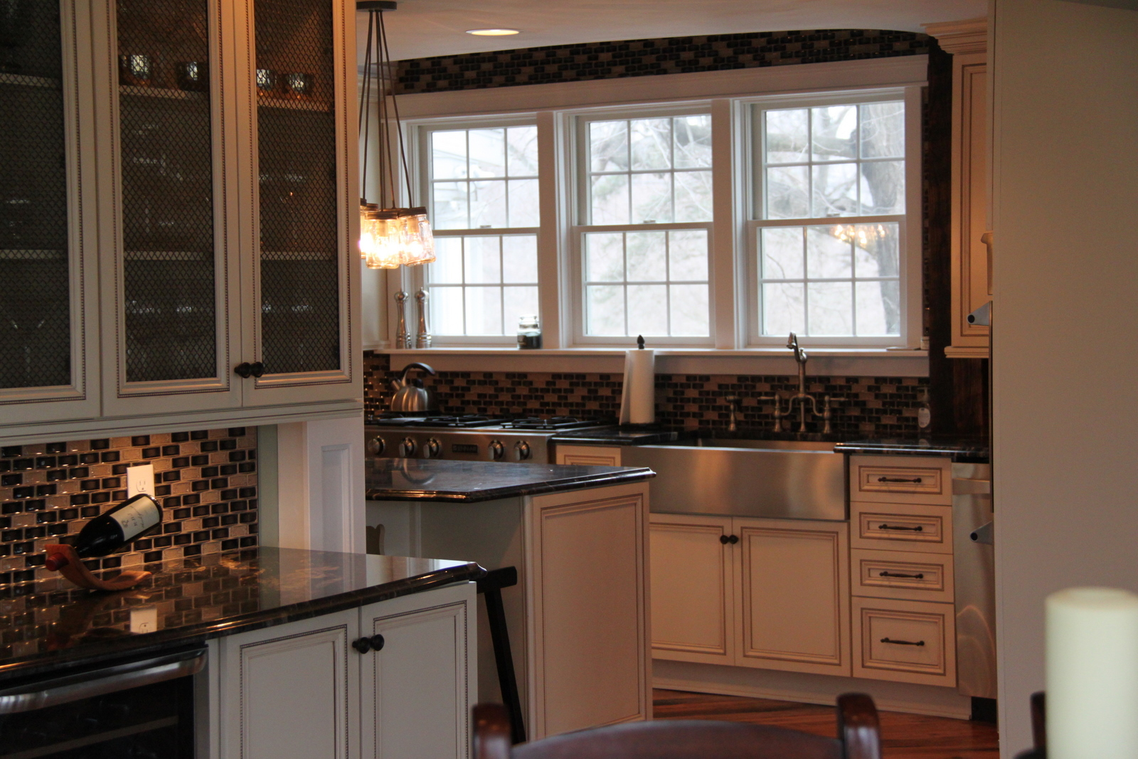 Warm custom kitchen remodel with detailed cabinetry
